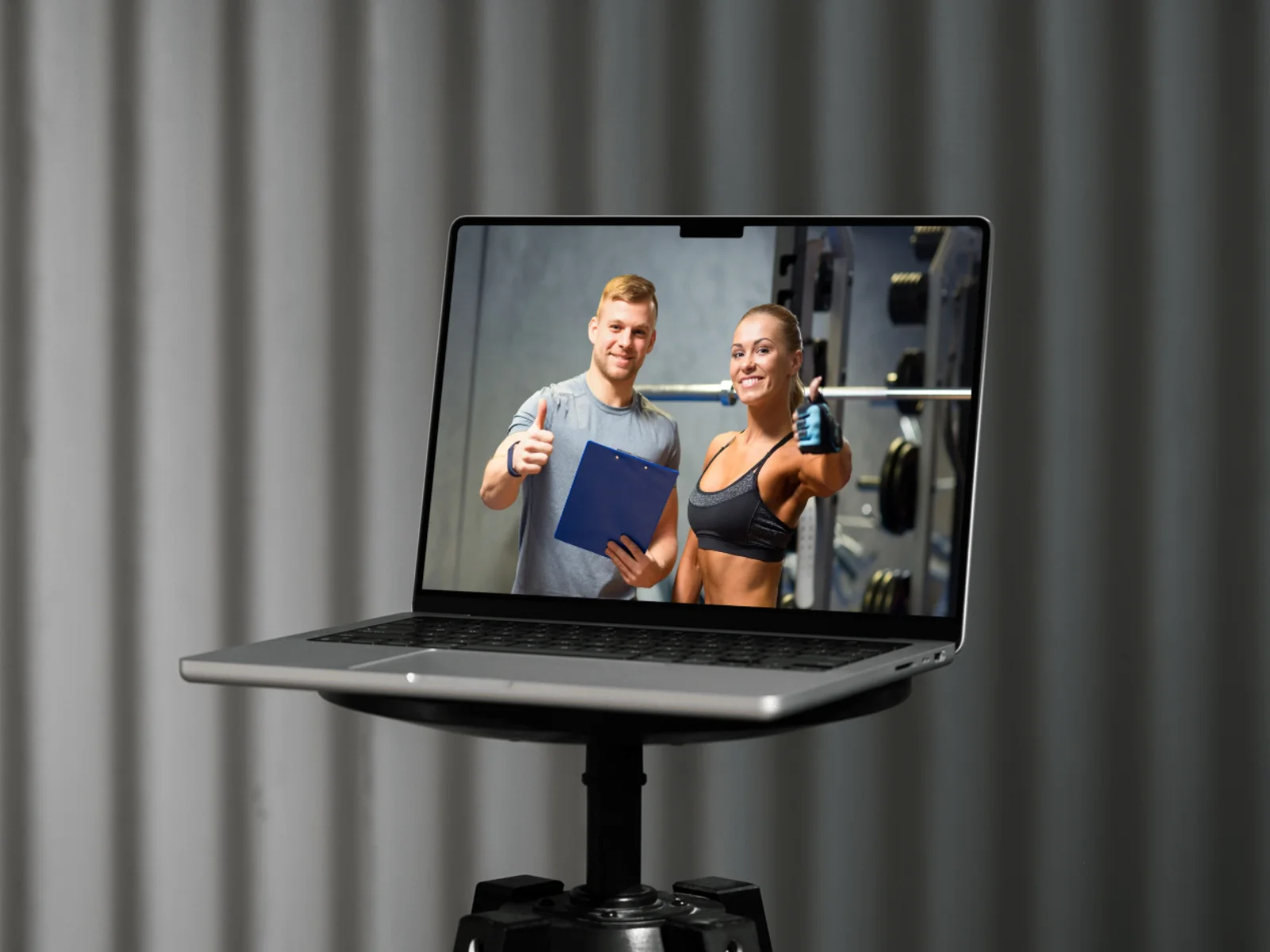 laptop with live streamed fitness professionals